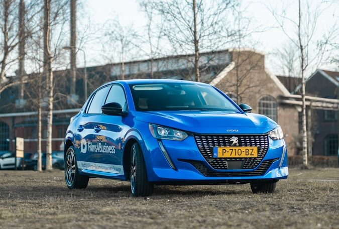 a blue car parked in a parking lot